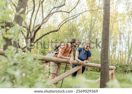 Similar – Image, Stock Photo Hiker observing forest in binoculars