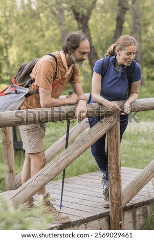 Similar – Image, Stock Photo Hiker observing forest in binoculars