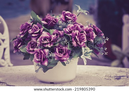 fake flower as purple rose in pot, process color