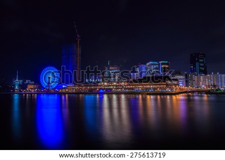 KOBE - April 7 : Time lapse view of Ferris wheel in Kobe Harborland on Apr 7,2015 in Kobe,Japan.Kobe Harborland is a shopping and entertainment district along the waterfront of Kobe\'s port area.