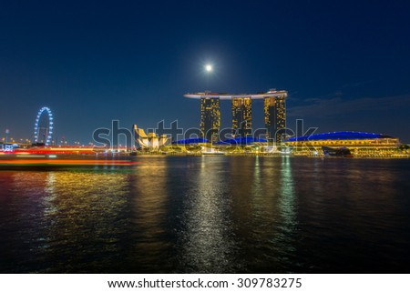 SINGAPORE - JUNE  30 : Marina Bay Sands hotel light show at night on JUNE 30, 2015 in Singapore. It is the world\'s most expensive building with cost of US$ 4.7 billion and landmark of Singapore.