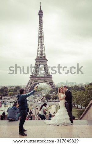 PARIS, FRANCE - JUNE 3: Pre Wedding shooting at eiffel Tower is the most visited monument in France and the most famous symbol of Paris, June 3, 2015, process color