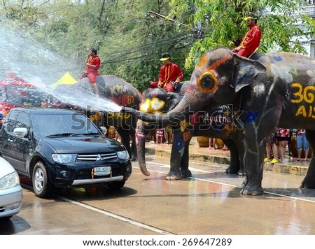 Ayutthaya -THAILAND 15 April 2015 - Elephants and Thai people join in water splashing during Thai new year festival.
