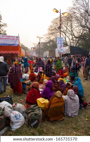 BABUGHAT, KOLKATA, WEST BENGAL / INDIA - 9TH JANUARY 2013 : Female devotees gossiping  on 9th January, 2013 in Babughat, Kolkata. They are on their way to Gangasagar (Sagar) - sacred place for Hindus.