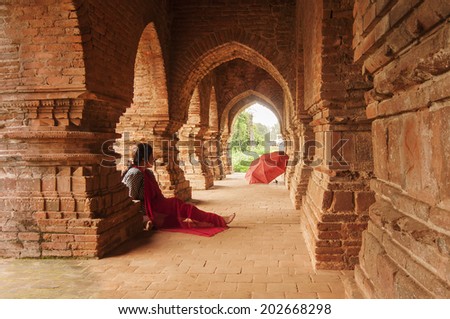 BISHNUPUR, WEST BENGAL / INDIA - OCTOBER 23, 2013 : Woman visitor at Rasmancha , old brick temple bulit in 1587. It is a famous world tourist spot in India