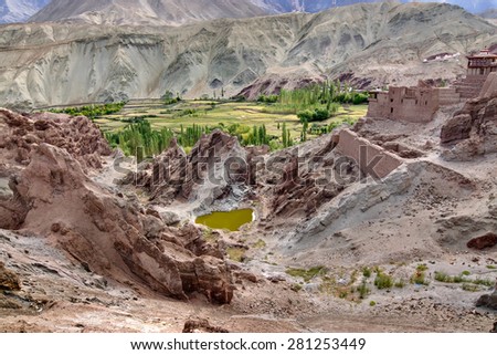 Ruins at Basgo Monastery with stones , rocks and a pond, natural view from top, Leh, Ladakh, India