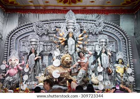 KOLKATA , INDIA - OCTOBER 2, 2014 : Durga idol at Puja festival. Biggest religious festival of Hinduism and local Bengali community, documentary editorial.
