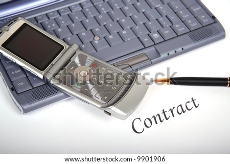 Computer keyboard and phone.