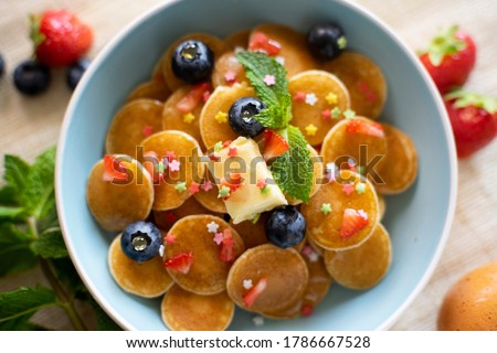 Similar – Image, Stock Photo Tiny cereal pancakes and strawberries