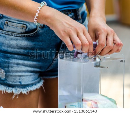 Similar – Image, Stock Photo charity fundraising donations fifty hryvnia in an acrylic box