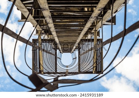 Similar – Foto Bild alte rostige Treppe mit Schäden gegen den blauen Himmel und die Wolken