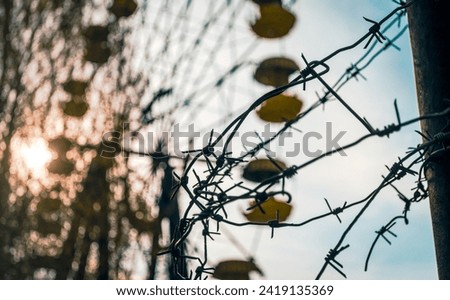 Similar – Image, Stock Photo barbed wire and carousel in amusement park in Chernobyl