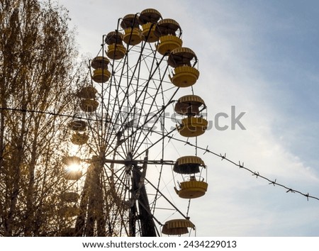 Image, Stock Photo barbed wire and carousel in amusement park in Chernobyl