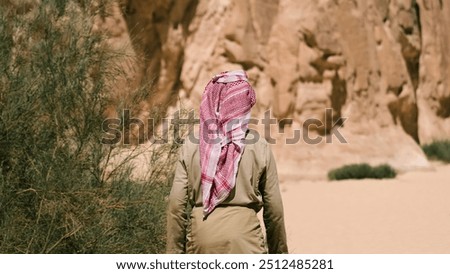 Similar – Image, Stock Photo bedouin in white goes in the canyon in the desert in Egypt