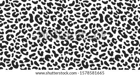 Seamless vector animal skin pattern. Leopard spots pattern. Black and white wildlife background. For fabric, textile, wrapping, cover, web etc. 10 eps design.
