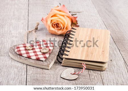 Notebook and decorations made from sustainable bamboo or recycled cardboard, text space