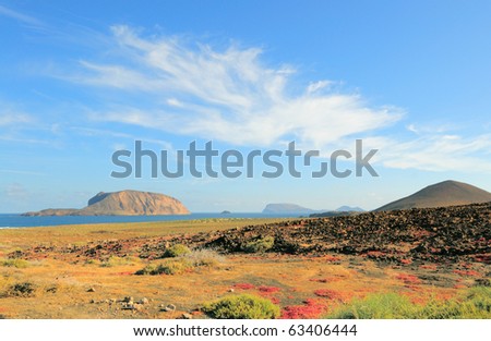 North-Western edge of Island Graciosa with an ancient volcano on the right and Island Montana Clara across the water. Canary islands, Spain