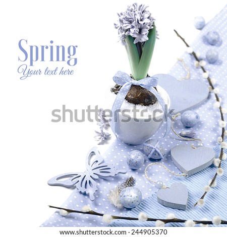 Purple hyacinth with matching Easter decorations on white background, toned image, corner element