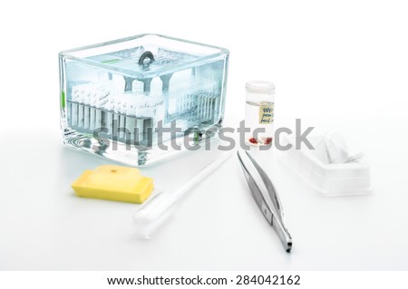 Tools for histochemical analysis of patient tissue (fixed tissue samples, paraffin blocks and Coplin jar with sections stained for microscopic analysis)