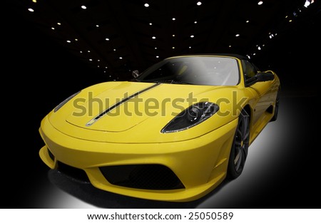 yellow sports car on a black background