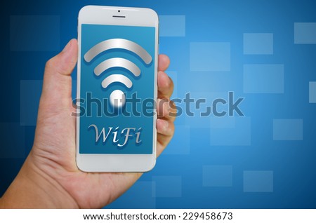 hand hold smart phone with WiFi icon