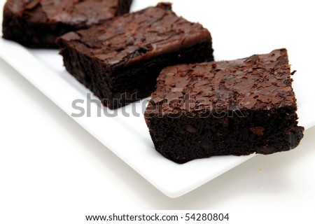 Sweet And Tasty Chocolate Brownies Served On A White Rectangular Plate ...