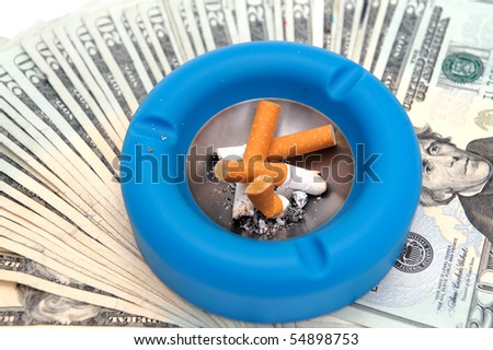 Concept of the waste of money that is spent for the cigarette smoker or the cash that could be saved