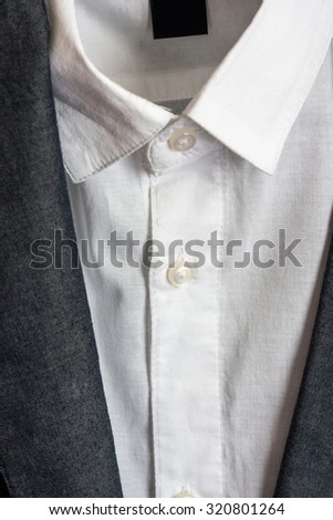 Shirt and jacket close up. Buttons and collar