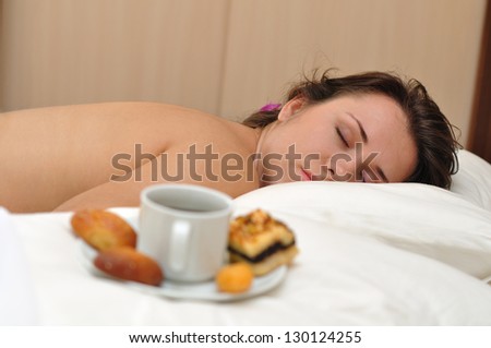The girl sleeps near morning coffee