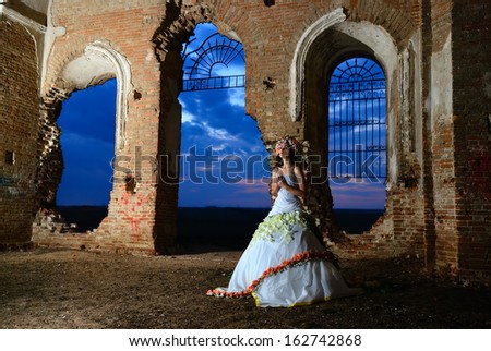 bride at night in the room of the destroyed church
