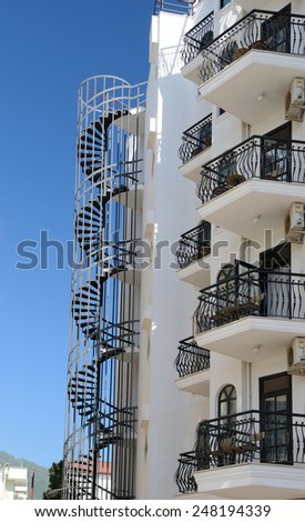 House with forged balcony railings and stairs