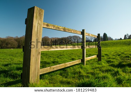 The wooden fence in rural Parbold, England on a beautiful spring day.