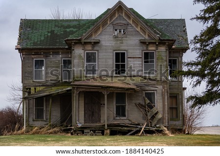 Similar – Foto Bild Alt | Hausfassade mit blätterndem Putz, mit blauen Planen statt Fenstern und einer Lampe