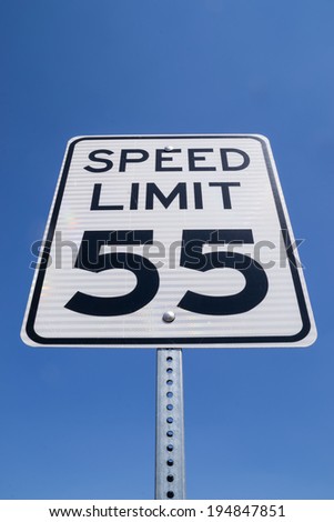 The fifty-five miles per hour street sign in the California sun.
