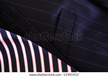 Pin stripe suit jacket with striped tie