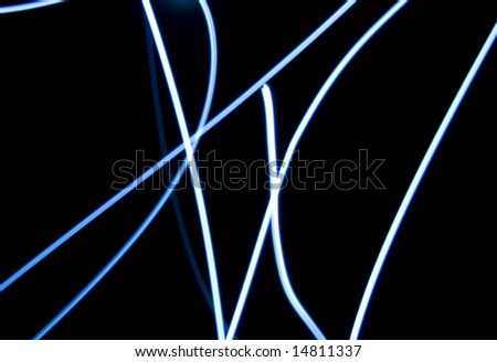 An abstract image of light trails made with a torch