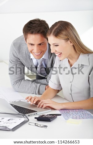 Happy man and woman Finding a job in the internet with laptop computer