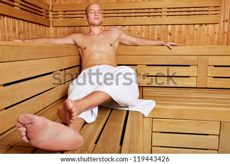 Man sitting relaxed in a steam sauna