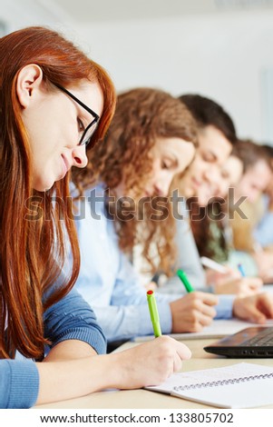 Students taking a test in class in a school