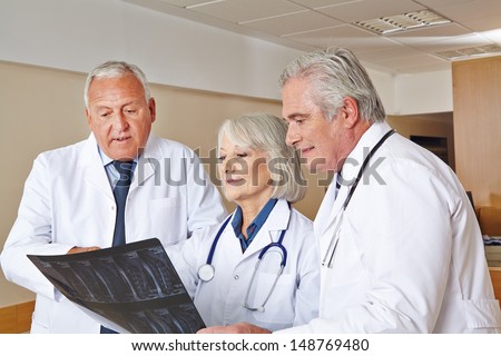Team of doctors watching x-ray image in a hospital