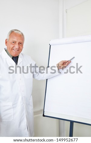 Doctor giving presentation at seminar with a flipboard
