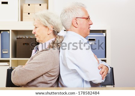 Angry senior couple having a silent fight at home