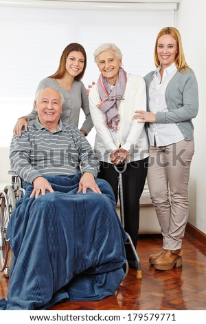 Family with three generations and senior couple at home