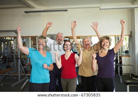 Group of elderly people having fun in gym