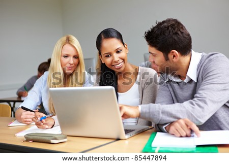 Students learning together in class in universty
