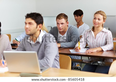 Many students learning in a university class