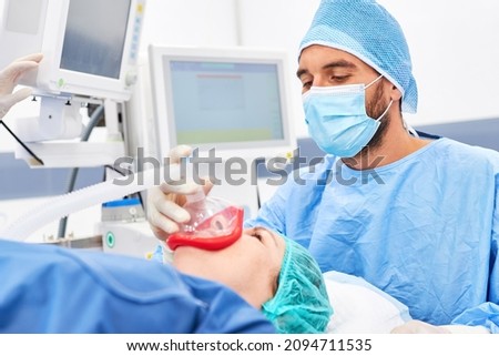 Anesthesiologist gives patient anesthesia treatment for general anesthesia before surgery Stock foto © 