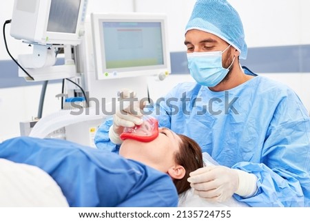 Anesthetist takes care of anesthesia and ventilation for the patient during the operation Stock foto © 