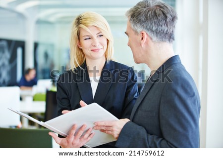 Negotiations in office lead to success for business man and woman