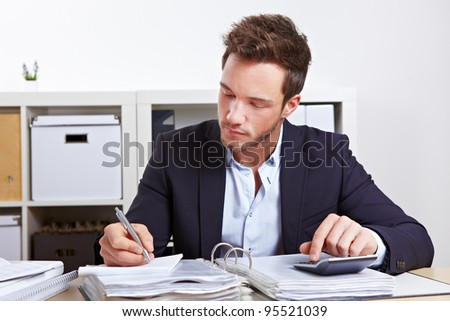 Business Man Working With Calculator And Files In Office Stock Photo ...